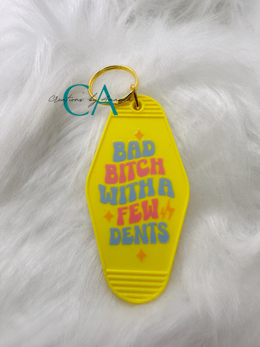 Motel Keychain - Bad Bitch with a Few Dents (Yellow)